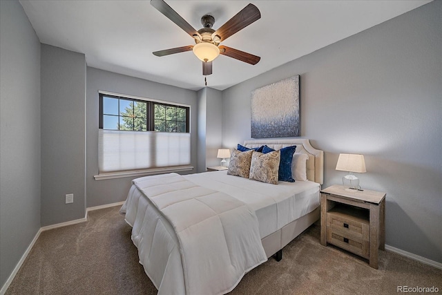 carpeted bedroom with baseboards and a ceiling fan