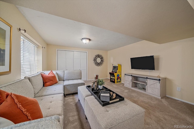 living area with baseboards and carpet