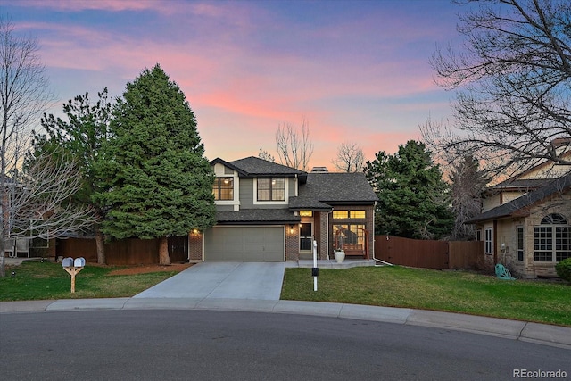 view of front of home with driveway, an attached garage, brick siding, fence, and a lawn