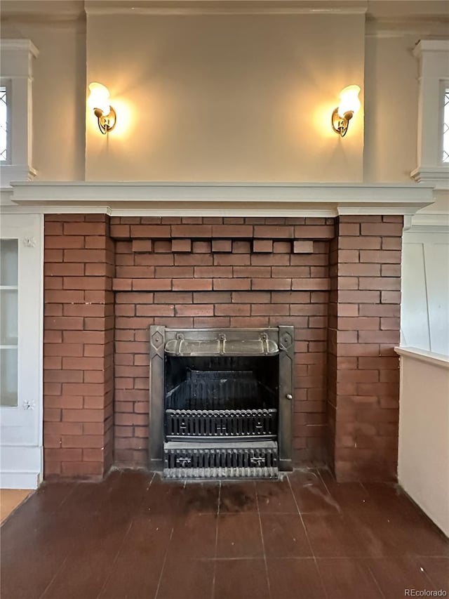 details featuring a fireplace and ornamental molding