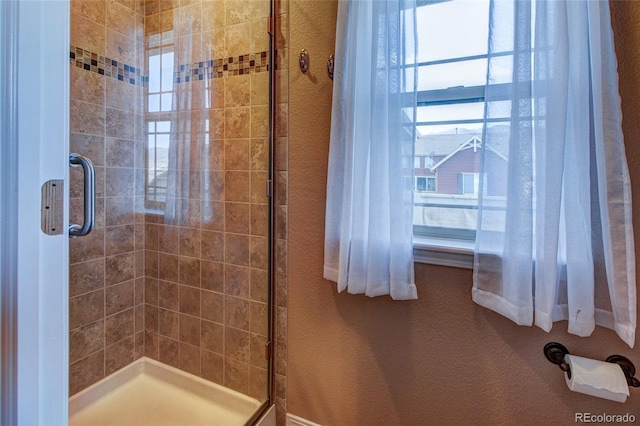 bathroom featuring an enclosed shower