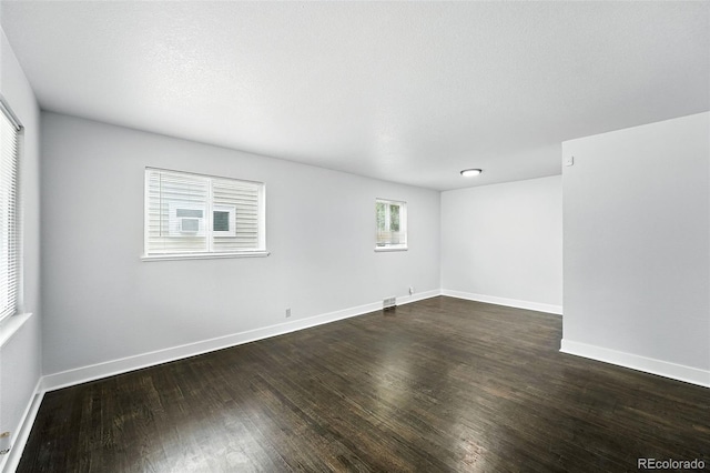 1941 Alton St, Aurora, CO 80010 - empty room with dark wood-style floors and baseboards
