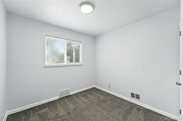 1941 Alton St, Aurora, CO 80010 - spare room featuring dark carpet and baseboards