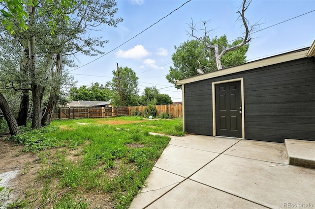 1941 Alton St, Aurora, CO 80010 - view of yard featuring a patio and an outbuilding