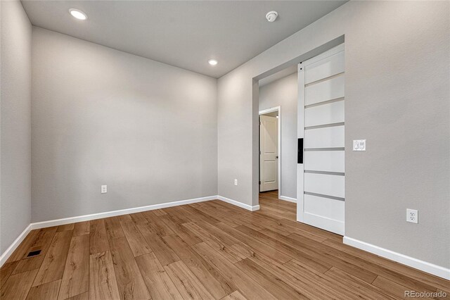 interior space with recessed lighting, light wood-type flooring, and baseboards