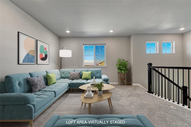 carpeted living room with recessed lighting, a textured ceiling, and baseboards