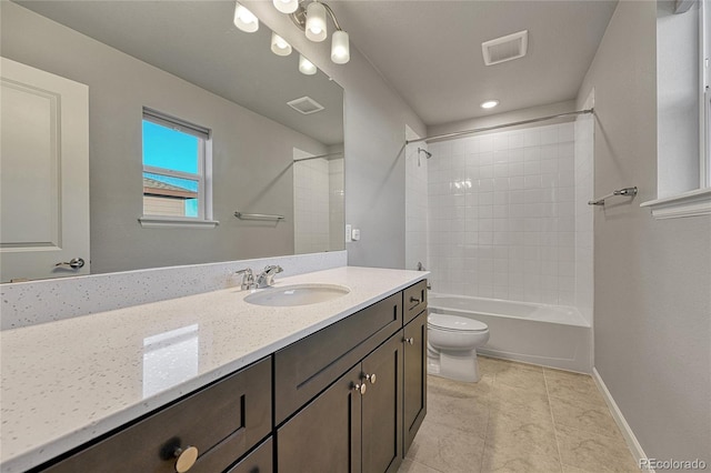 bathroom featuring baseboards, visible vents, toilet, and vanity