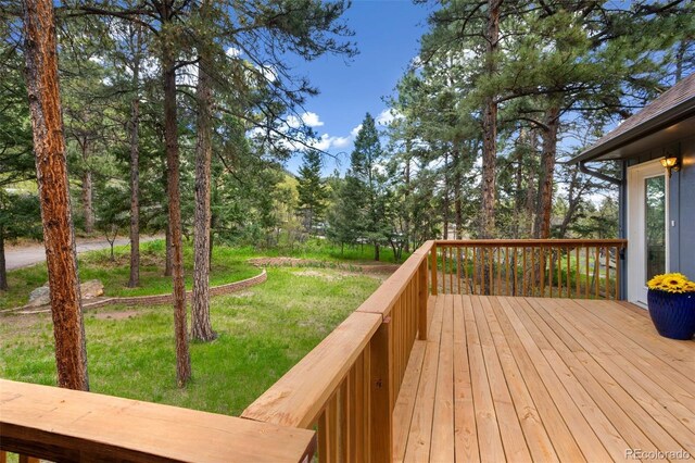 4835 Abo Ln, Monument, CO 80132 - wooden deck featuring a lawn