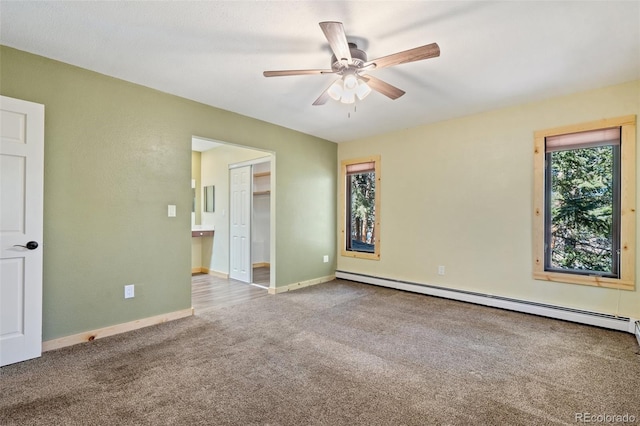 4835 Abo Ln, Monument, CO 80132 - spare room featuring a baseboard radiator, carpet, a ceiling fan, and baseboards