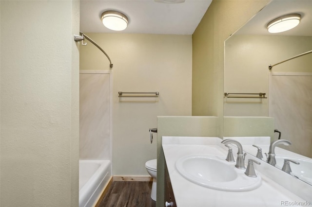 4835 Abo Ln, Monument, CO 80132 - full bathroom featuring wood finished floors, shower / washtub combination, vanity, toilet, and baseboards