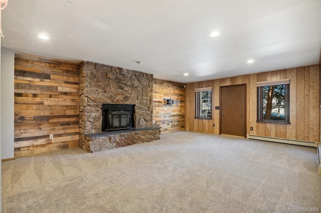 4835 Abo Ln, Monument, CO 80132 - unfurnished living room featuring a baseboard heating unit, wood walls, recessed lighting, and carpet floors