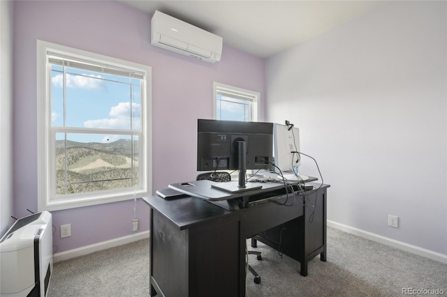 office space with light colored carpet and a wall unit AC