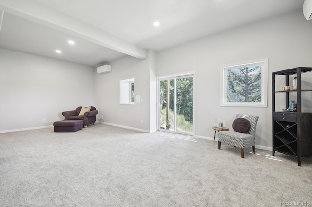 living area with beamed ceiling, light colored carpet, and a wall unit AC