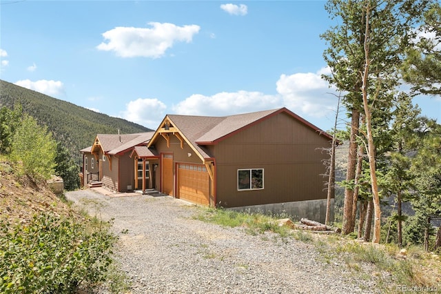 view of front of property featuring a mountain view and a garage