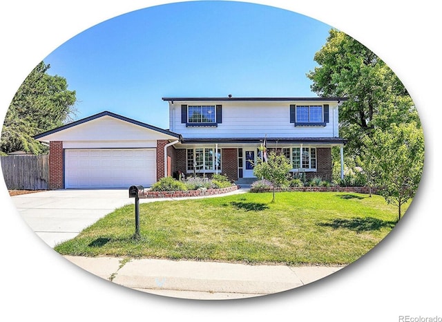 view of front of property featuring a garage, covered porch, and a front yard