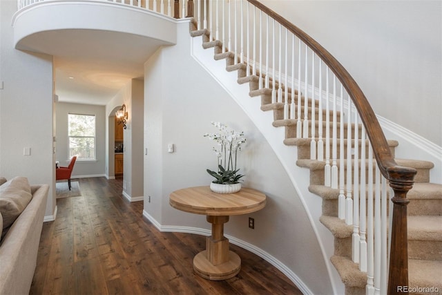 stairs featuring wood-type flooring