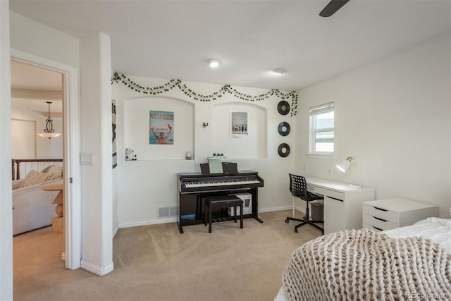 bedroom with light carpet and ceiling fan