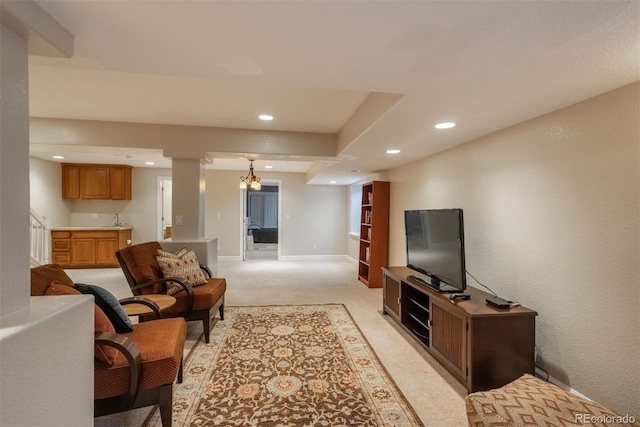 living room with sink and light carpet