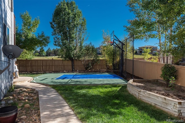 view of yard with basketball court