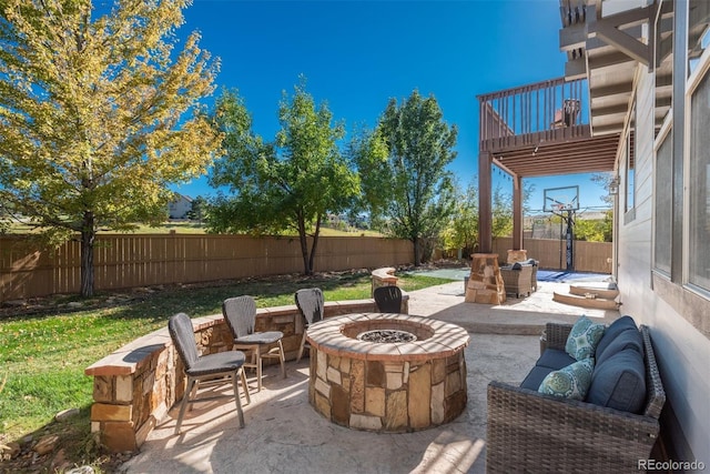 view of patio / terrace featuring an outdoor living space with a fire pit