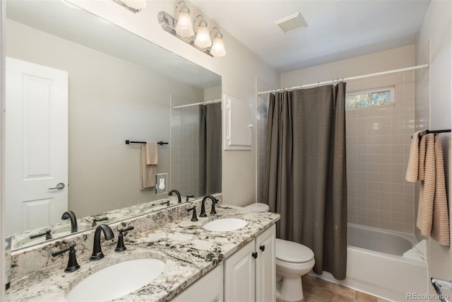 full bathroom with vanity, toilet, shower / bathtub combination with curtain, and tile patterned floors