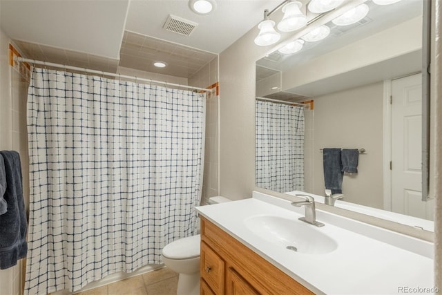 bathroom featuring curtained shower, tile patterned flooring, vanity, and toilet