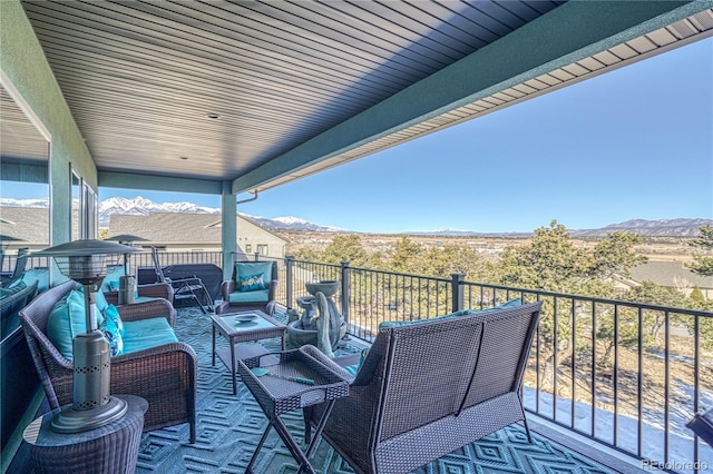 exterior space featuring an outdoor living space and a mountain view