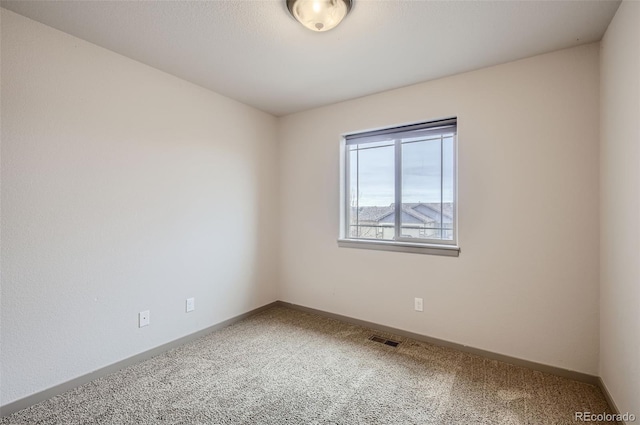 empty room with carpet flooring