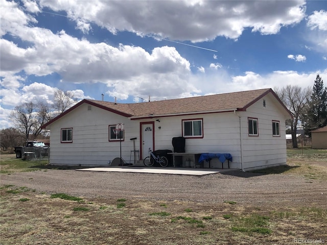 rear view of property featuring a patio area