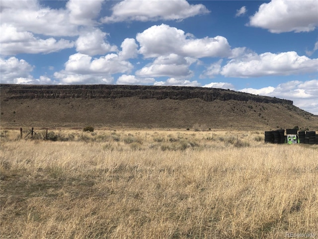 view of mountain backdrop featuring rural landscape