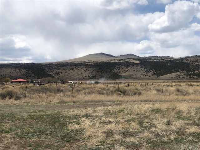 view of mountain background with rural landscape
