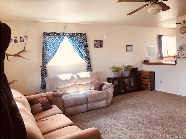 living room featuring ceiling fan and carpet floors