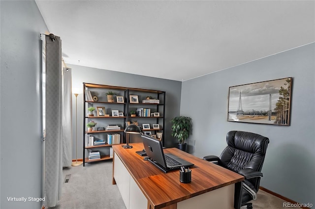 carpeted home office featuring baseboards and visible vents