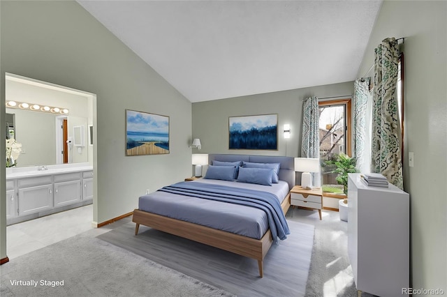 bedroom with baseboards, a sink, connected bathroom, high vaulted ceiling, and light carpet