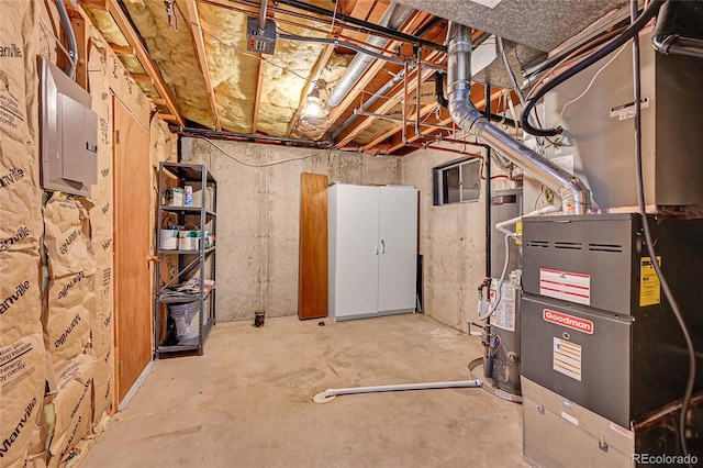 unfinished below grade area featuring heating unit, electric panel, and water heater