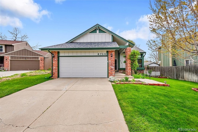view of front of property with fence, brick siding, and a front yard