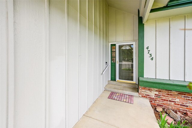 property entrance with board and batten siding