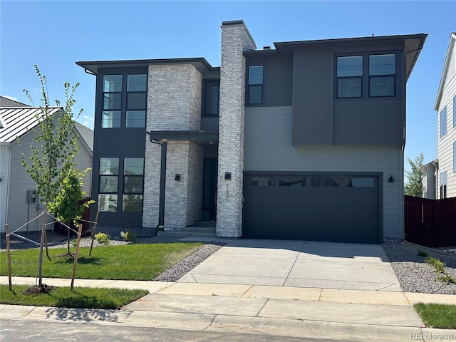 1621 Winter Glow Dr, Windsor, CO 80550 - modern home with an attached garage, concrete driveway, and a chimney