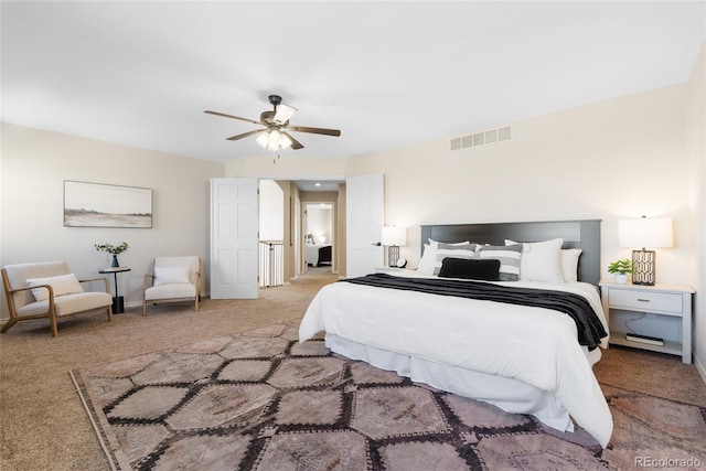 bedroom with ceiling fan and light colored carpet