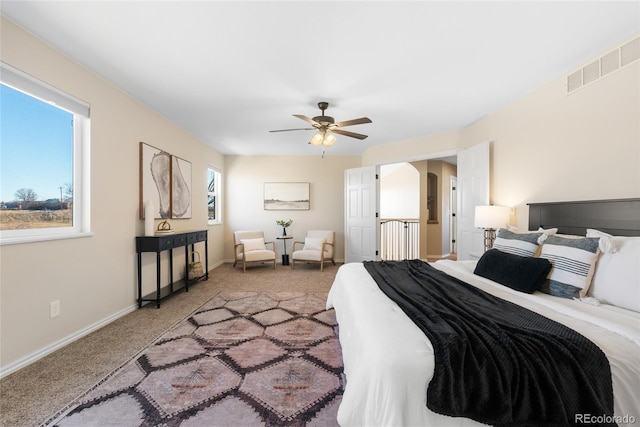 carpeted bedroom with ceiling fan