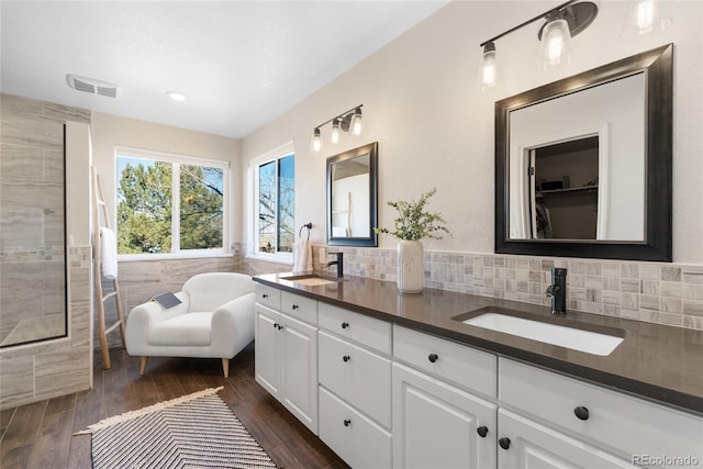 bathroom featuring backsplash and vanity