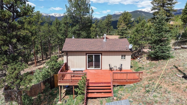 60 Ball Rd, Bailey, CO 80421 - rear view of house featuring a deck with mountain view and roof with shingles