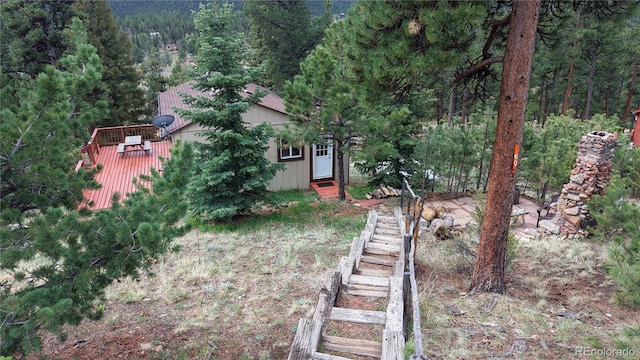 60 Ball Rd, Bailey, CO 80421 - view of yard with a view of trees, a wooden deck, and stairway
