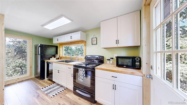 60 Ball Rd, Bailey, CO 80421 - kitchen featuring black appliances, a sink, butcher block countertops, and healthy amount of natural light