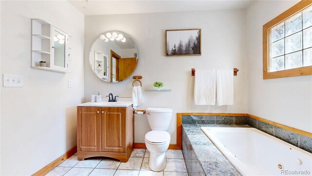 60 Ball Rd, Bailey, CO 80421 - bathroom featuring toilet, a whirlpool tub, vanity, and baseboards