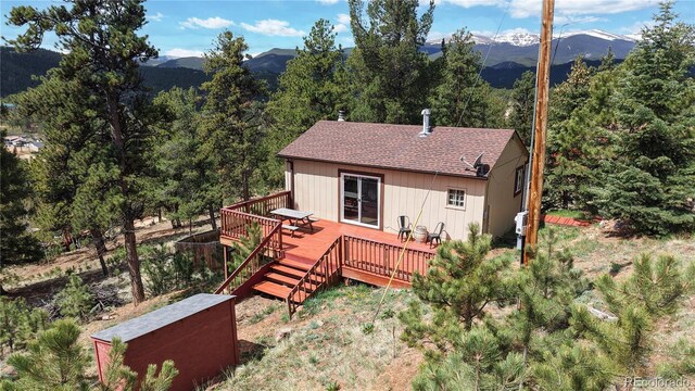 60 Ball Rd, Bailey, CO 80421 - back of property with a deck with mountain view