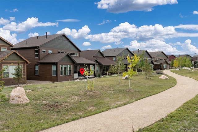 view of front of home featuring a residential view and a front yard