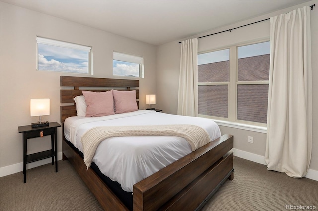 carpeted bedroom with baseboards
