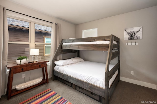 bedroom featuring baseboards and carpet flooring