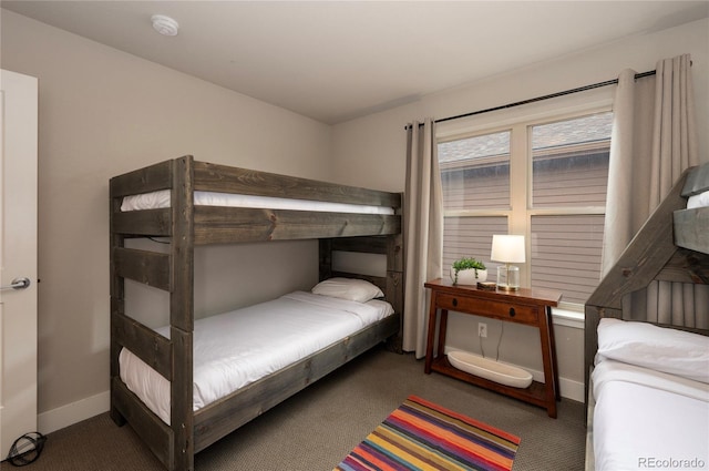 bedroom with carpet floors and baseboards